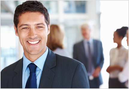 guy in grey suit smiling